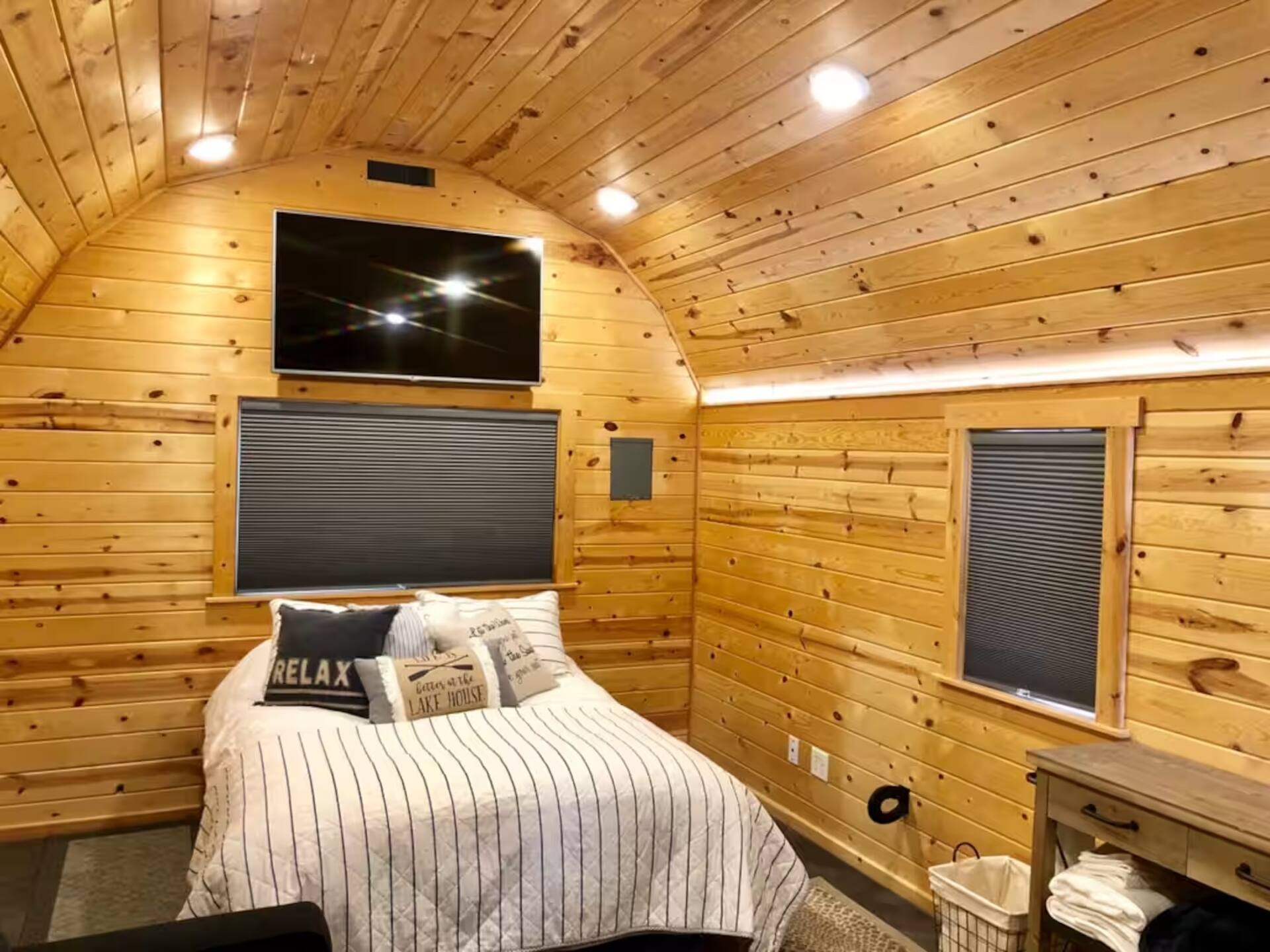 Cedar-lined tiny cabin sleeping space