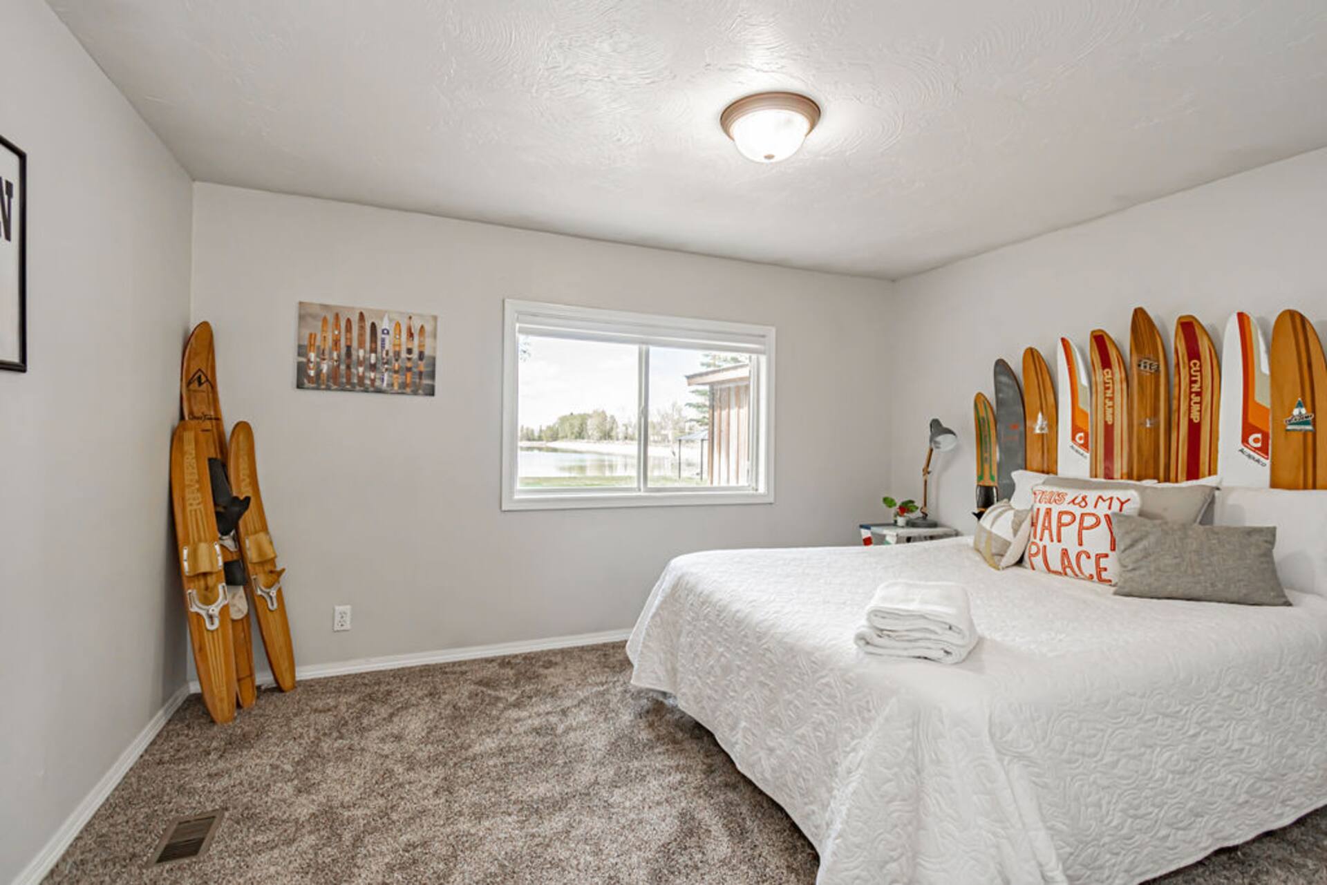 Bedroom with vintage water skis on the wall