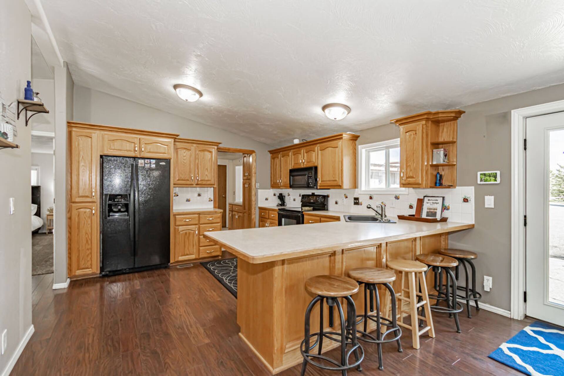 Kitchen with island and bar stools